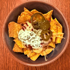 Nachos with salsa, cheese, sour cream & jalepeno