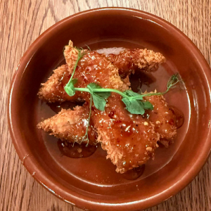 Buttermilk chicken goujons with sweet chilli and hot honey glaze.